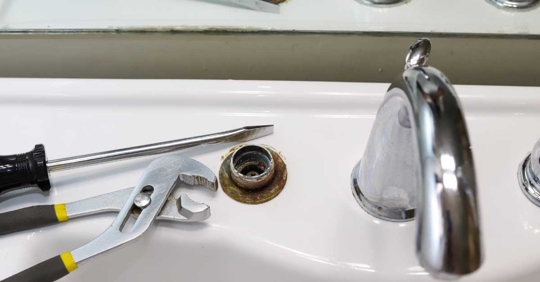 broken bathroom sink faucet fixture